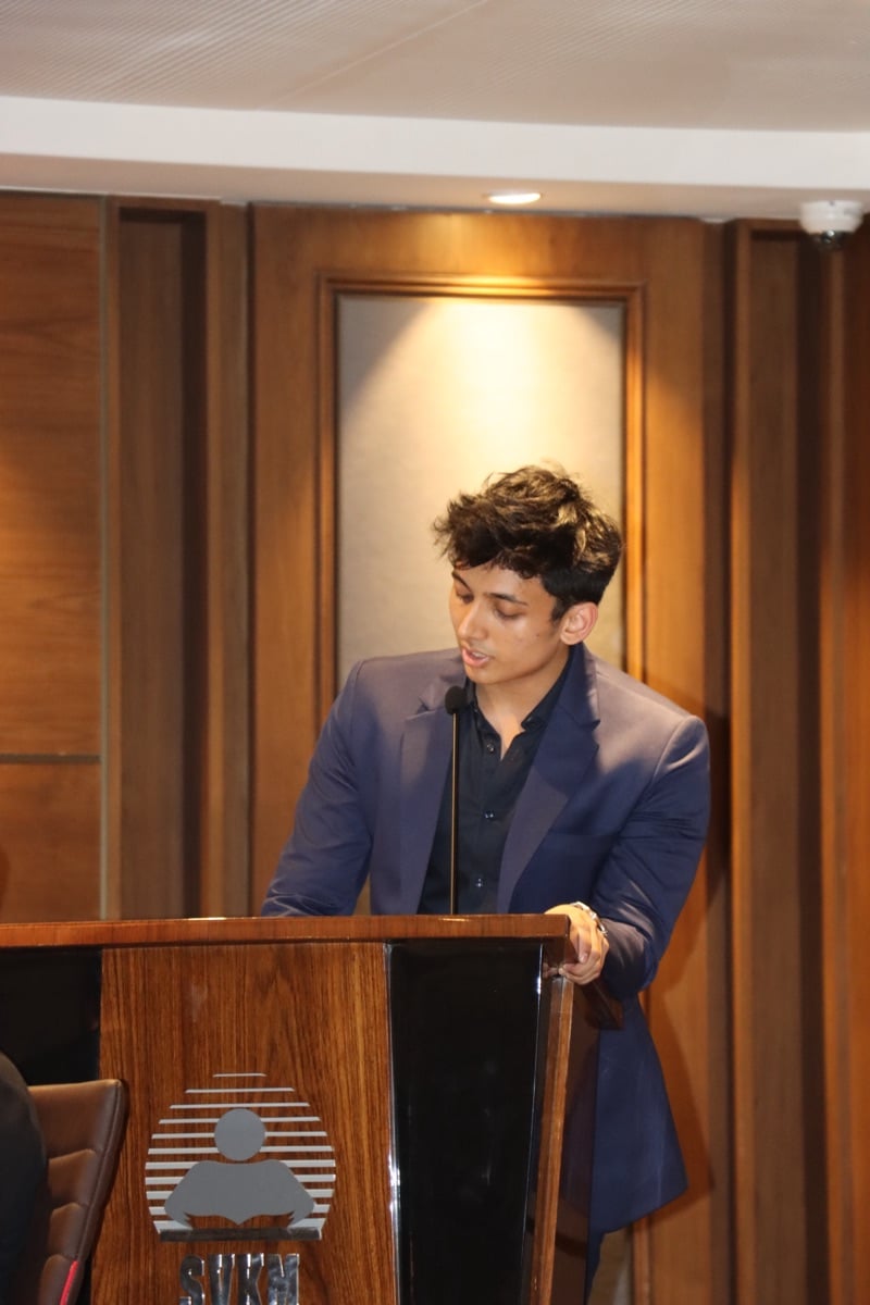 Satyajeet Kadu - Senior Forward Deployed AI Engineer speaking at a tech conference podium